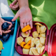 children holding snacks at school